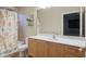Clean bathroom with shower/tub combo and wood vanity at 6114 Kingbird Manor Dr, Lithia, FL 33547
