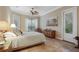 Bright bedroom with tiled floors and access to a private balcony at 6114 Kingbird Manor Dr, Lithia, FL 33547