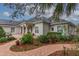 House exterior showcasing columns and lush landscaping at 6114 Kingbird Manor Dr, Lithia, FL 33547