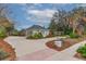 Two-car garage and driveway, offering ample parking space at 6114 Kingbird Manor Dr, Lithia, FL 33547