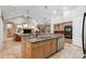 Open kitchen with granite countertops, stainless steel appliances, and an island at 6114 Kingbird Manor Dr, Lithia, FL 33547