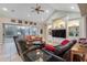 Bright living room with hardwood floors, comfy seating and large windows at 6114 Kingbird Manor Dr, Lithia, FL 33547