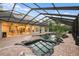 Relaxing screened in pool and spa with solar panels at 6114 Kingbird Manor Dr, Lithia, FL 33547
