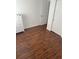 Bedroom with laminate wood floors and ample closet space at 7638 Woodbridge Blvd, Tampa, FL 33615