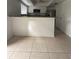 Spacious kitchen with breakfast bar and tile flooring at 7638 Woodbridge Blvd, Tampa, FL 33615
