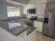 Modern kitchen with granite countertops and stainless steel appliances at 7638 Woodbridge Blvd, Tampa, FL 33615
