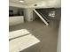 Open concept living area with tile floors and kitchen view at 7638 Woodbridge Blvd, Tampa, FL 33615