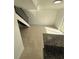 Bright living room with tile floors and stairs leading to upper level at 7638 Woodbridge Blvd, Tampa, FL 33615