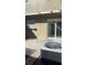 Small patio with sliding glass doors at 7638 Woodbridge Blvd, Tampa, FL 33615
