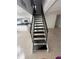 Modern staircase leading to the upper level at 7638 Woodbridge Blvd, Tampa, FL 33615