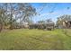 Spacious backyard with large grassy area and a pool at 823 Scenic Heights Dr, Brandon, FL 33511