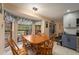 Kitchen dining area with a wood table and chairs, overlooking the backyard at 823 Scenic Heights Dr, Brandon, FL 33511