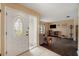 Home entryway with a white door and view into the living room at 823 Scenic Heights Dr, Brandon, FL 33511