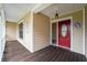 Wooden porch with a red front door and white railings at 823 Scenic Heights Dr, Brandon, FL 33511