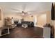 Living room with dark hardwood floors, fireplace, and access to backyard at 823 Scenic Heights Dr, Brandon, FL 33511