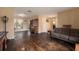 Living room with dark hardwood floors and a gray couch at 823 Scenic Heights Dr, Brandon, FL 33511