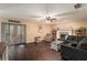 Spacious living room with dark hardwood floors, a fireplace and a large sectional sofa at 823 Scenic Heights Dr, Brandon, FL 33511