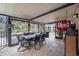 Screened patio with table and chairs, perfect for outdoor dining at 823 Scenic Heights Dr, Brandon, FL 33511