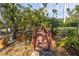 Wooden footbridge over a pond in a tranquil garden setting at 8755 Commodore Dr, Seminole, FL 33776