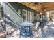 Covered patio with seating area, perfect for outdoor dining at 8755 Commodore Dr, Seminole, FL 33776