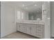 Modern bathroom with double vanity and large mirror at 920 N Osceola Ave # 507, Clearwater, FL 33755