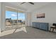 Bedroom with a dresser, large windows, and access to balcony at 920 N Osceola Ave # 507, Clearwater, FL 33755