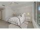 Bright bedroom with a comfortable bed, nightstands, and large windows at 920 N Osceola Ave # 507, Clearwater, FL 33755