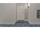 Private hallway entrance with nautical themed welcome mat at 920 N Osceola Ave # 507, Clearwater, FL 33755