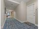 Clean and well-lit building hallway with blue carpeting at 920 N Osceola Ave # 507, Clearwater, FL 33755