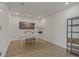 Bright home office with a white desk, comfortable chair, and built-in shelving at 920 N Osceola Ave # 507, Clearwater, FL 33755