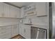 Modern kitchen with white cabinets and a stainless steel sink at 920 N Osceola Ave # 507, Clearwater, FL 33755
