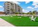 Artificial turf lawn with cornhole and seating at 920 N Osceola Ave # 507, Clearwater, FL 33755