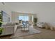 Spacious living room with hardwood floors and large windows at 920 N Osceola Ave # 507, Clearwater, FL 33755