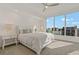Large bedroom with a comfortable bed, nightstands, and ceiling fan at 920 N Osceola Ave # 507, Clearwater, FL 33755