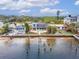 Aerial view of waterfront home with private dock and surrounding houses at 1022 Canal St, Ruskin, FL 33570