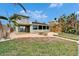 Spacious backyard with a waterfront view and patio at 1022 Canal St, Ruskin, FL 33570