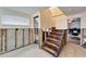 Unfinished basement area with exposed walls and wooden stairs at 1022 Canal St, Ruskin, FL 33570