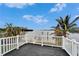 Deck overlooking the water with white railings at 1022 Canal St, Ruskin, FL 33570