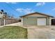 House exterior with a light green color, attached garage, and walkway at 1022 Canal St, Ruskin, FL 33570