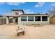House exterior showcasing large windows, a patio and waterfront view at 1022 Canal St, Ruskin, FL 33570