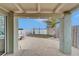 Covered patio overlooking a waterfront view with a wooden bench at 1022 Canal St, Ruskin, FL 33570