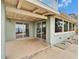 Covered patio with sliding glass doors offering a beautiful waterfront view at 1022 Canal St, Ruskin, FL 33570