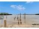 Tranquil waterfront view with wooden pilings and calm waters at 1022 Canal St, Ruskin, FL 33570