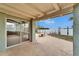 View from covered patio showcasing the waterfront, with sliding glass doors at 1022 Canal St, Ruskin, FL 33570