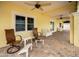 Relaxing covered patio with brick pavers and comfortable seating at 11325 5Th E St, Treasure Island, FL 33706