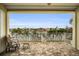 Relaxing balcony overlooking the water with stunning views and patio furniture at 11325 5Th E St, Treasure Island, FL 33706