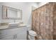 Bathroom with single vanity and shower/tub combo at 11325 5Th E St, Treasure Island, FL 33706
