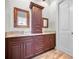 Double vanity with granite countertop and wood cabinets at 11325 5Th E St, Treasure Island, FL 33706