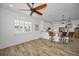 Bedroom with wood flooring, ceiling fan, and kitchen views at 11325 5Th E St, Treasure Island, FL 33706