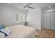 Spacious bedroom with king bed, wood floors, and ample closet space at 11325 5Th E St, Treasure Island, FL 33706